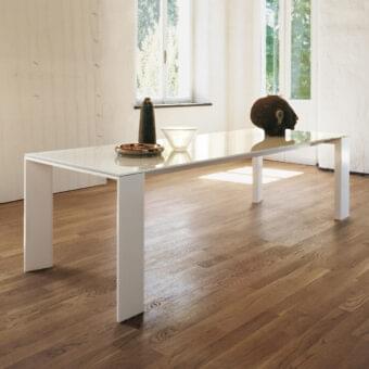 Elegant Sovet Italia Toronto table with tempered glass and Wengè-stained oak in a distinctive "V" profile finish