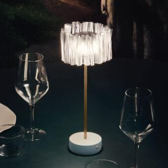 Elegant Slamp Accordéon battery lamp with satin white shade and golden stem in anodized aluminum