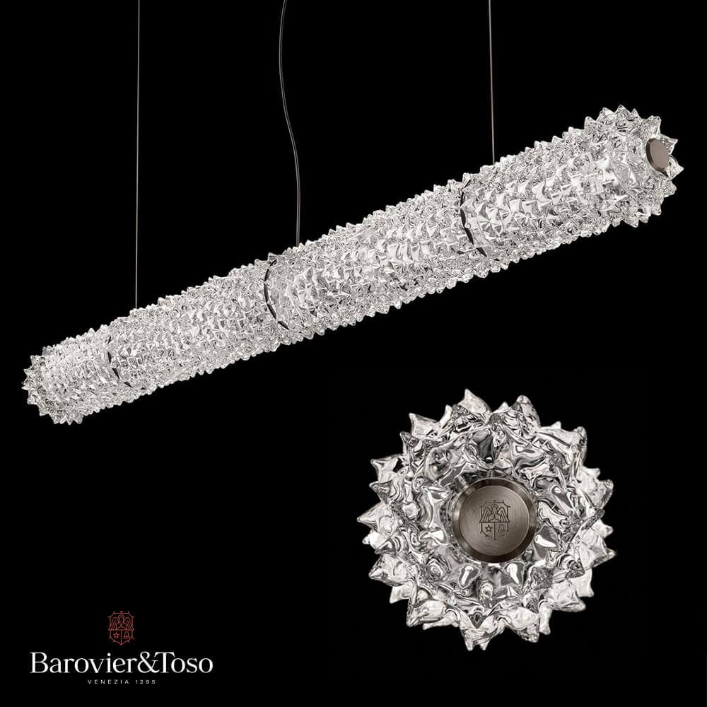 Crystal chandeliers with geometric designs, one linear and one radial, suspended against black; Barovier&Toso brand with Venezia 1295 text.
