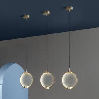 Distinguished Masiero Horo suspension lamp with circular light elements and warm gold metal structure crafted in Italy