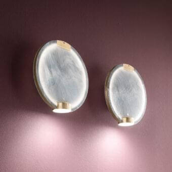 Superior Masiero Horo wall lamp with metal structure and swirling marbled light grey glass diffuser emitting a warm glow