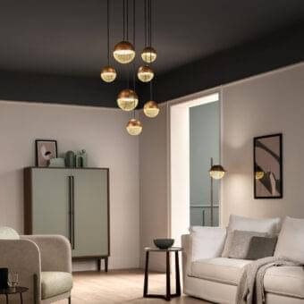 Distinguished Masiero Iglù suspension lamp with brushed patina metal and refined matt gold mesh diffusers suspended from warm wood