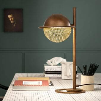 Distinctive Masiero Iglù table lamp with bronze-like lampshade and matt gold open grid crafted in cylindrical metal with brushed patina
