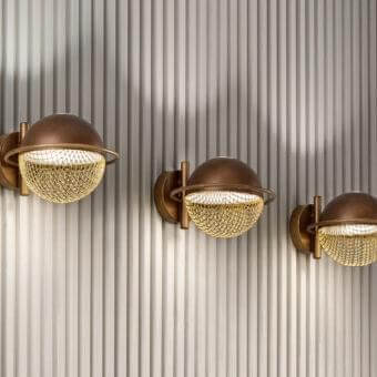 Distinguished Masiero Iglù wall lamp with spherical design crafted in brushed patina bronze and matt gold metal mesh diffuser