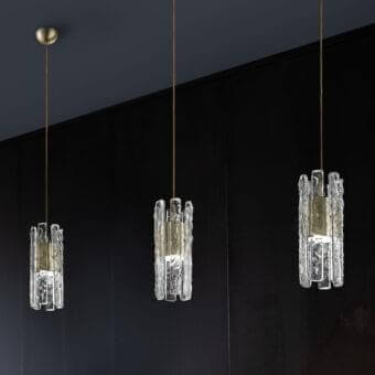 Distinguished Masiero Vegas suspension lamp with rock-effect glass strips and gold-toned metal components crafted in a contemporary Italian design