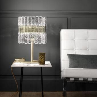 Elegant Masiero Vegas table lamp with a metal structure and rock-effect glass strips in golden hues