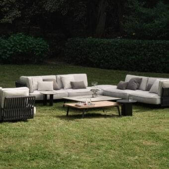 Stylish Potocco Soul sectional with interweaving backrest and armrests in dark material, complemented by light gray cushions and coordinating pillows