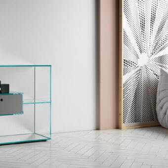 Distinguished Tonelli Design Liber console in extra clear glass with mirrored base and matte grey drawer accents