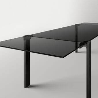 Innovative Tonelli Design Livingstone table with glossy black glass top and matching metal frame built with a flapping mechanism