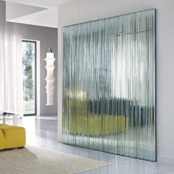 Distinctive Tonelli Design Vu mirror with extra clear glass elements encased in a dark frame offering a textured surface