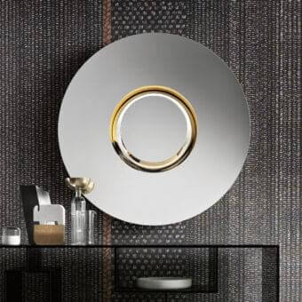 Distinguished Tonelli Design Ozma mirror with circular reflective surface and gilded metal framing in black painted wood