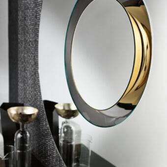 Superior Tonelli Design Ozma mirror with circular silhouette and gilded metal accents in light green with black painted wood