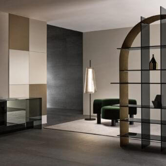 Exceptional Tonelli Design Paradigma bookcase with arched silhouette and brushed bronze metal sheet frame crafted in extra clear glass