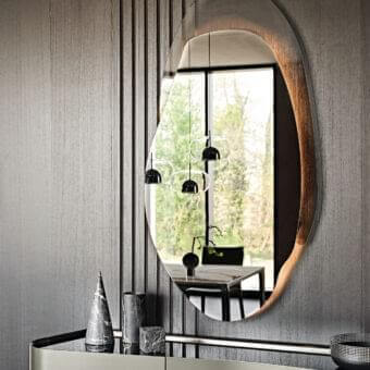 Distinguished Cattelan Italia Akumal mirror crafted in fumé glass with a fumé glass frame and organic asymmetrical form