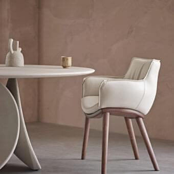 Lavish Cattelan Italia Rhonda Wood armchair with dark brown wood and light-colored synthetic leather upholstery boasts a smooth finish