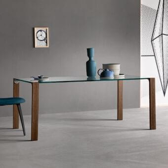 Distinctive Tonelli Design Livingstand table with tempered glass top and smooth medium-toned brown wooden legs