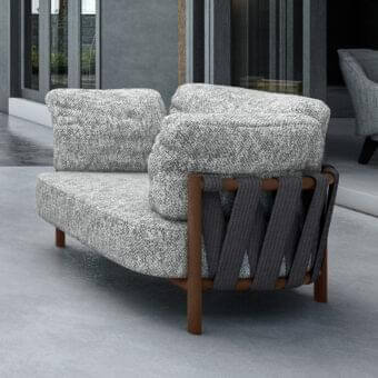 Distinctive Arketipo Punta Ala lounge chair with light gray and white mottled textile and matte medium-brown wood frame built with dark gray woven straps