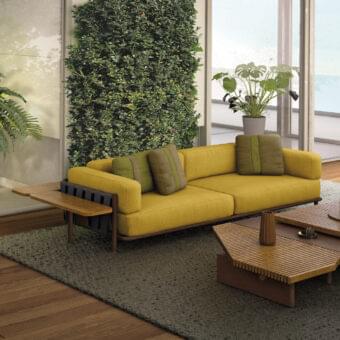 Exclusive Arketipo Punta Ala sofa with woven backrest and textured yellow textile upholstery accented with olive-green pillows