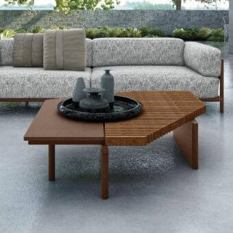 Elegant Arketipo Talamone coffee table with contrasting wood sections and cylindrical legs crafted in Italy with a smooth matte finish