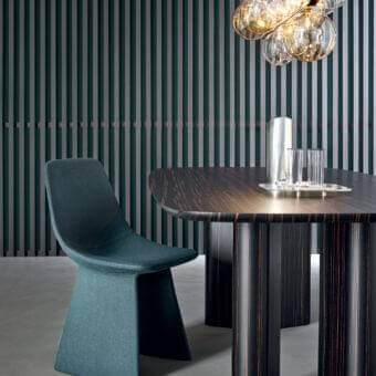 Distinctive Bonaldo Agea chair with rounded organic silhouette upholstered in muted teal fabric and steel structure