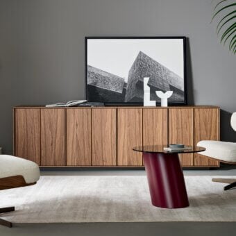 Elegant Bonaldo Backdrop sideboard with medium-toned brown wood doors and a natural wood grain finish built on an anthracite grey melamine plinth base