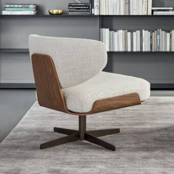 Elegant Bonaldo Olos lounge chair with curved wood structure upholstered in light textile and dark metal base