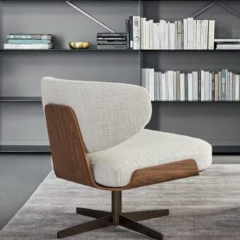 Distinctive Bonaldo Olos lounge chair with curved wood structure and woven textile upholstery in satin finish