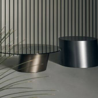 Elegant Bonaldo Pisa coffee table with transparent glass top and satin-finished bronze-toned metal base