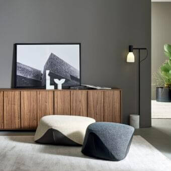 Distinguished Bonaldo Seki ottoman with cream textile and black leather showcasing smooth, irregular lines crafted in Italy