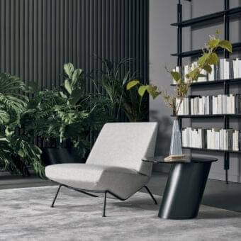 Superior Bonaldo Sleek Lounge Chair with light gray fabric upholstery and a dark metal frame built with circular feet
