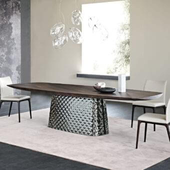 Sophisticated Cattelan Italia Atrium Wood table with Canaletto walnut barrel top and quilted curved glass base