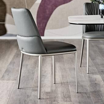 Elegant Cattelan Italia Belinda ML chair with curved upholstery in dark gray synthetic material and silver brushed lacquered steel base