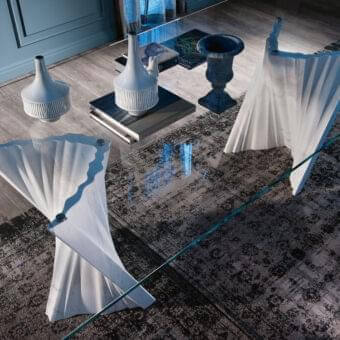 Captivating Cattelan Italia Plisset table with a clear glass top and sculptural matt Palissandro white marble base