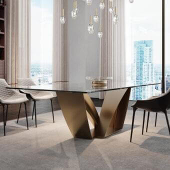Distinguished Reflex Apeiron table with rectangular glass top and curved iron V-shaped base in bronze or gold toned finish