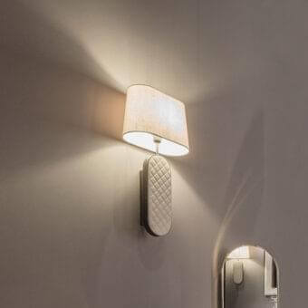 Stylish DV Home Collection Coco wall lamp with quilted leather and a light cream textile lampshade