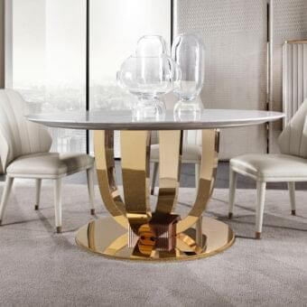 Distinguished DV Home Collection Hermes table crafted in Italy with light grey marble-like top and reflective golden stainless steel base