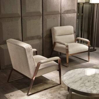 Superior DV Home Collection Hollywood lounge chair upholstered in light beige textile with a glossy metal frame and quilted back