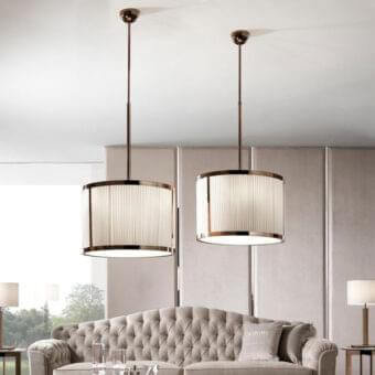 Elegant DV Home Collection Windsor lamp with white cannetè fabric and a reflective metal structure