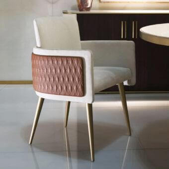 Distinguished Reflex Amet armchair with wooden structure, light beige textile and reddish-brown quilted synthetic material, plus polished golden metal legs