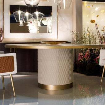 Exceptional Reflex Amet armchair built with wood, creamy textile upholstery, tan quilted side panels and glossy metal legs