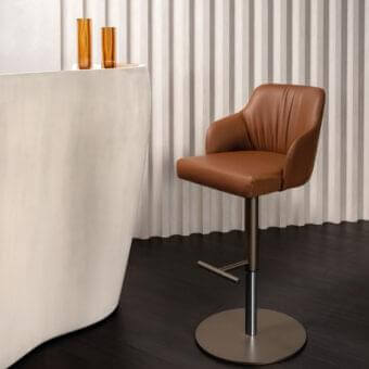 Superior Reflex Comfort stool with brown leather-like upholstery and satin finished metal base