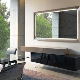 Elegant Reflex Prisma mirror with mirrored glass and light emanating from behind its rectangular silhouette with a glossy finish