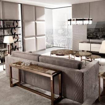 Elegant DV Home Collection Age sofa back console with rose-gold-toned stainless steel base and brown stone-grain tabletop