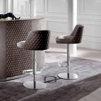 Sophisticated Byron stool from DV Home Collection with brown upholstery, stainless steel base and diamond-quilted backrest crafted in wood