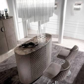 Sophisticated DV Home Collection Byron stool with light gray quilted textile upholstery and chrome finished stainless steel pedestal
