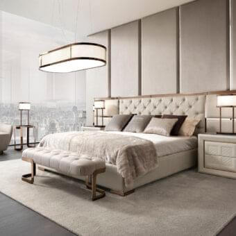Exclusive DV Home Collection Chelsea bed with plush light beige textile and refined metal trim detailing