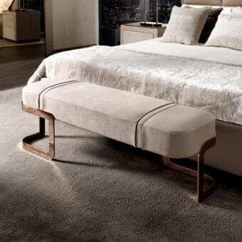 Elegant DV Home Collection Coco bench with neutral beige upholstery and warm bronze-toned steel legs