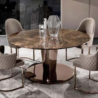 Elegant DV Home Collection Stanley table with swirling brown marble top and reflective bronze-toned stainless steel base exhibiting a glossy finish
