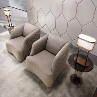 Elegant DV Home Collection Venice lounge chair in smooth beige fabric with refined hexagon quilting and sleek metal base