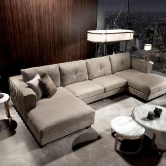 Distinguished DV Home Collection Beverly sectional upholstered in neutral beige fabric with subtle button tufting and refined vertical quilting